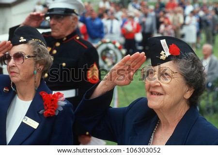 CIRCA 1998 - World War II Women Veterans saluting at ceremony at Veteran\'s National Cemetery, Los Angeles, California