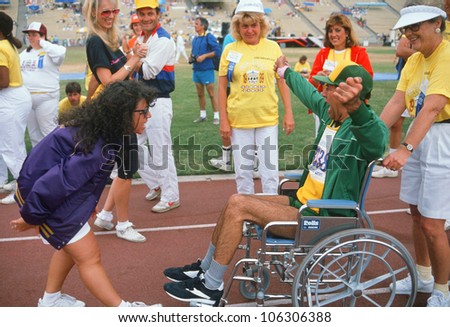 CIRCA 1989 - Man in wheelchair at finish line, Special Olympics at UCLA, Los Angeles, California