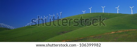 These are windmills along Route 580 at the Altamont Pass. It is a form of wind energy or alternative energy. It is springtime.