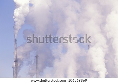 Pollution from smokestacks filling the air at the Boise Cascade Paper Plant in Rumford, Maine