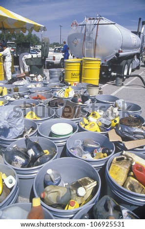 CIRCA 1990 - Containers of used oil and other toxic household chemicals awaiting further disposal at a Unocal station in Los Angeles, California