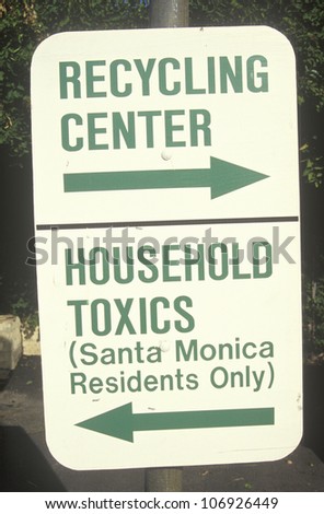 CIRCA 1992 - A green street sign designating recycling areas at the Santa Monica Community Center