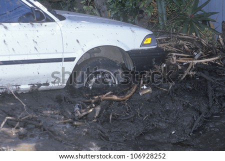 CIRCA 1994 Ã¢Â?Â? A small car stuck after the mudslides in Malibu, California