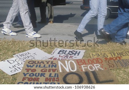 CIRCA 1991 - Protest signs on lawn at peace rally,  Los Angeles, California