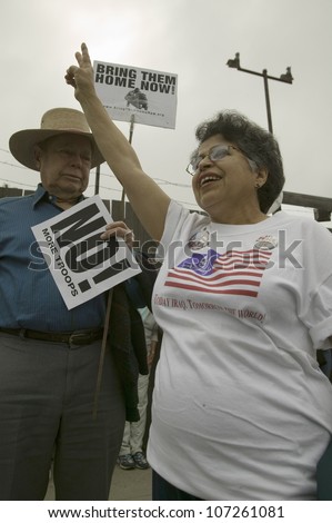 A woman protester gives the peace sign at an anti-Iraq War protest march in Santa Barbara, California on March 17, 2007