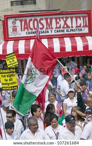 Taqueria stands in view as Immigrants participate in march for Immigrants and Mexicans protesting against Illegal Immigration reform by U.S. Congress, Los Angeles, CA, May 1, 2006