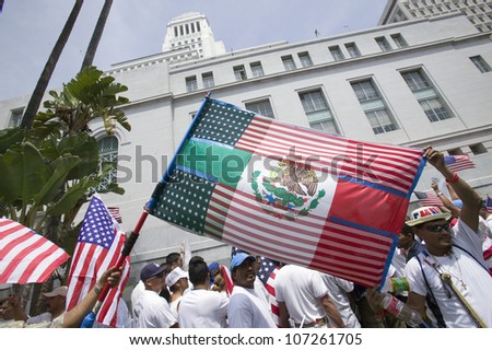Mexican flag is superimposed over American flag in front of City Hall, protesting against Illegal Immigration reform by U.S. Congress, Los Angeles, CA, May 1, 2006