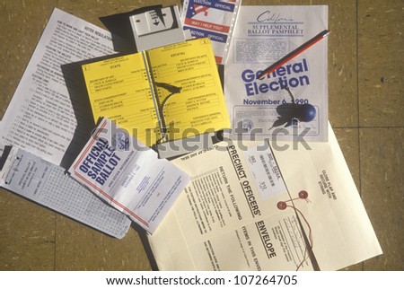 NOVEMBER 2004 - Close-up of a voting booth with ballots, ballot machine and election pamphlets, CA