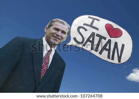 MARCH 2005 - Picture of anti-Bush political rally in Tucson, AZ with a sign saying President George W. Bush Loves Satan in Tucson, AZ