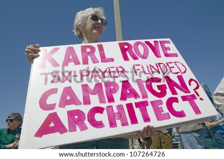 MARCH 2005 - Picture of anti-Bush political rally in Tucson, AZ with signs about Karl Rove in Tucson, AZ