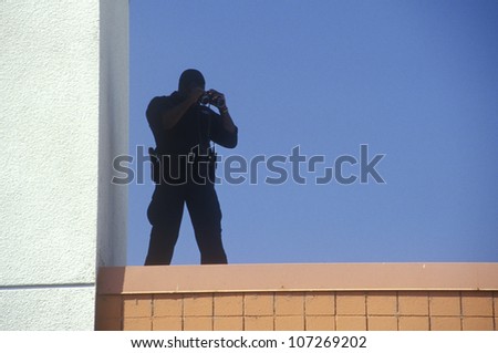 Secret Service agent on rooftop security duty during Clinton/Gore 1992 campaign