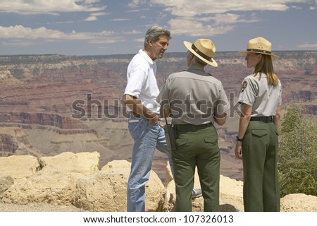 AUGUST 2004 - Senator John Kerry speaking with 2 rangers at rim of Bright Angel Lookout, Grand Canyon, AZ