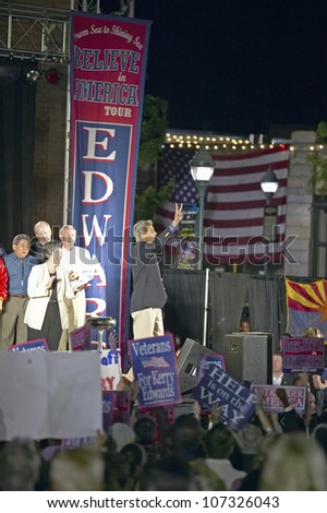 AUGUST 2004 - Senator John Kerry gives the peace sign from stage of Believe in America campaign tour, Kingman, AZ