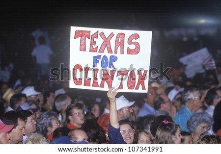 Texas For Clinton sign stands out in the crowd during the Clinton/Gore 1992 Buscapade campaign tour in Tyler, Texas