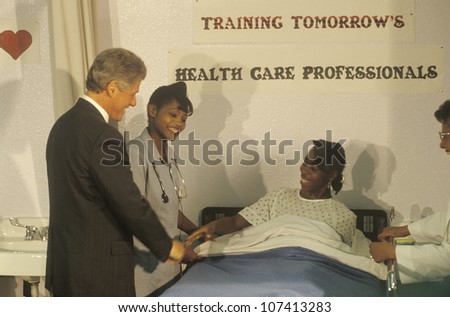 Governor Bill Clinton greets patient at a nurse\'s job training program at the Maxine Waters Employment Preparation Center in 1992, So. Central, LA