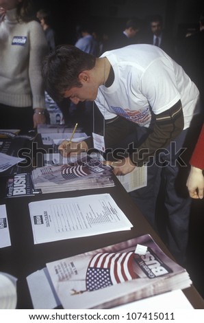 Student filling out a Youth for Bush sign-up sheet at the New Hampshire Presidential Candidates Youth Forum, January 2000