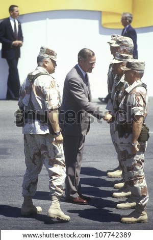 President Bush greets military personnel and General Schwartzkopf during the Desert Storm Victory Parade in Washington, D.C. 1991
