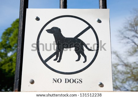 No dogs sign on a fence