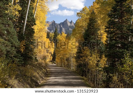 Dirt road leads to Chimney Peak and Courthouse Mountain in the Uncompahgre National Forest, Colorado
