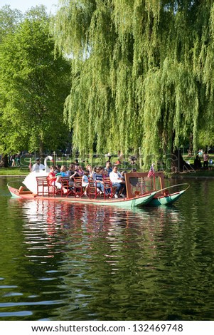 BOSTON - MAY 27: Swan boat with tourists in Public Garden and Boston Common on May 27, 2012, Boston, MA.