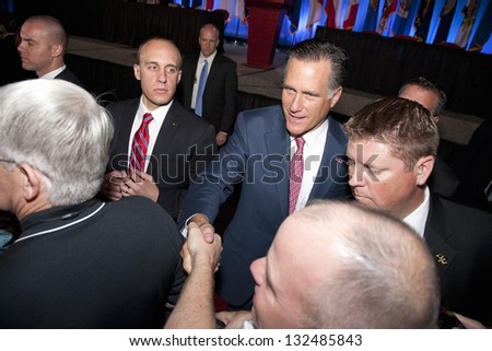 RENO - SEPTEMBER 11: Mitt Romney shakes hands with supporters at the annual meeting of the National Guard Association on September 11, 2012 in Reno, Nevada.