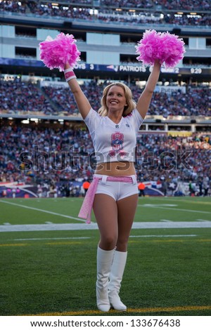 BOSTON - OCTOBER 16:  New England Patriots cheerleader cheers with Pink pom pom at Gillette Stadium on October 16, 2011 in Foxborough, Boston, MA