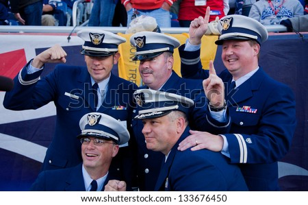 BOSTON - OCTOBER 16: Members of US Coast Guard wearing uniform pose for picture at Gillette Stadium, New England Patriots vs. the Dallas Cowboys on October 16, 2011 in Foxborough, Boston, MA