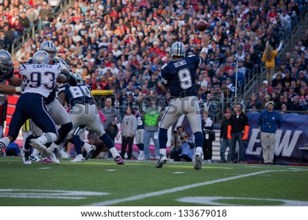 BOSTON - OCTOBER 16: Quarterback Tony Romo, No 9 of Dallas Cowboys, passes footballll at Gillette Stadium, New England Patriots vs. Dallas Cowboys on October 16, 2011 in Foxborough, Boston, MA