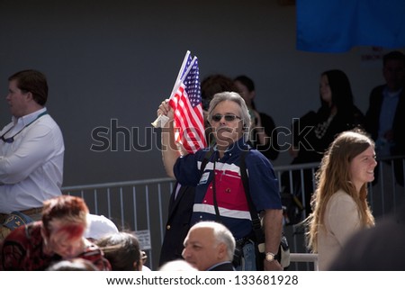 HENDERSON, NV - OCTOBER 23: Supporter with flag for Governor Mitt Romney on a Presidential Campaign rally on October 23, 2012 at Henderson Pavilion in Henderson, NV