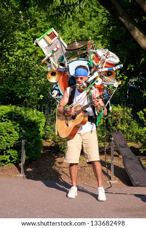 Boston - May 27: One-Man Band Musician Plays In Public Gardens On May 27, 2012 In Boston, Ma