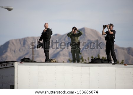 NORTH LAS VEGAS - NOVEMBER 01: Secret Service agents scan audiences during President Barack Obama`s Campaign Rally, November 01, 2012  at Cheyenne Sports Complex, North Las Vegas, Nevada
