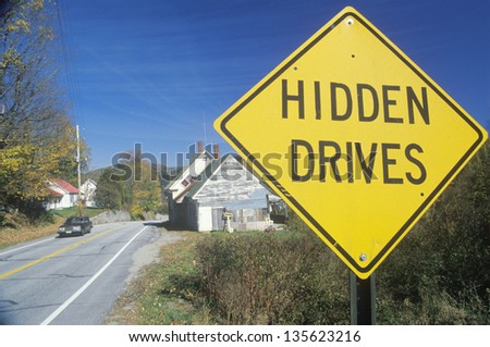 Hidden Drives sign along a country road