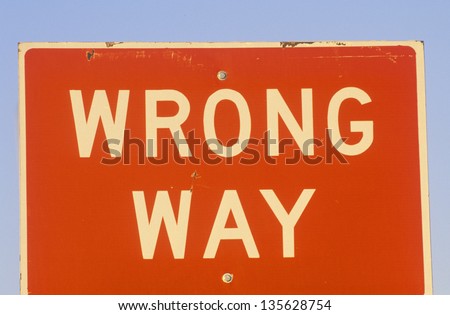 Close-up of red Wrong Way sign