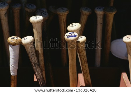 Baseball bats standing on end