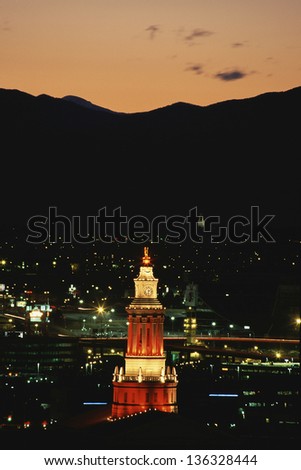 Lit clock tower in Denver, CO
