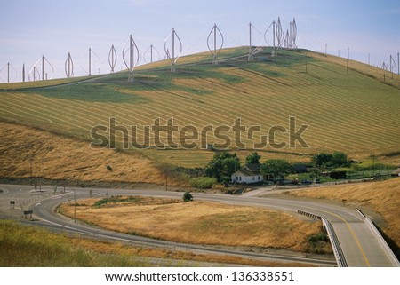 Hill with vertical-axis wind turbines