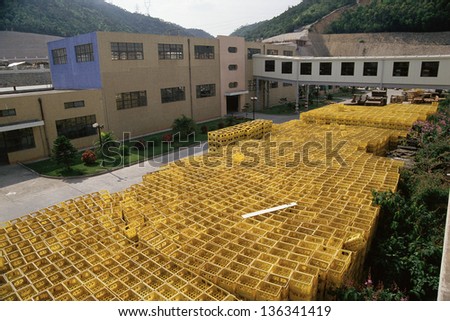 Empty yellow crates in the yard of a warehouse Shenzen Brewery, China
