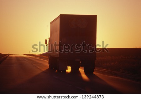 Silhouette of a truck at sunset