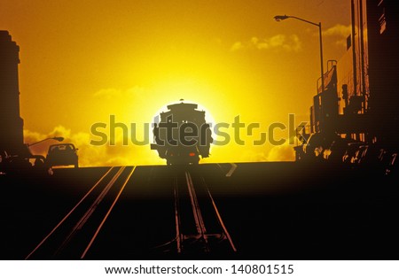 Sunset behind one of San Francisco\'s famous cable cars, San Francisco, California