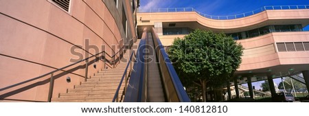 Escalator and stairs lead upwards to a building in downtown Los Angeles, California