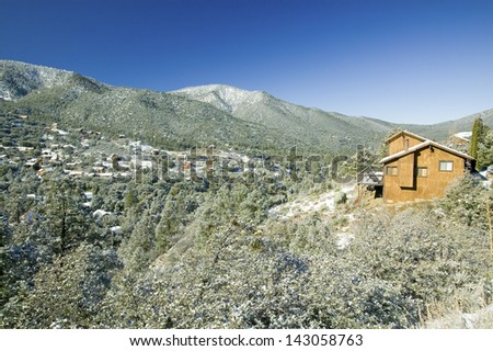 Snowy landscape with mountain cabin after winter storm in Pine Mountain Club, Kern County, Southern California