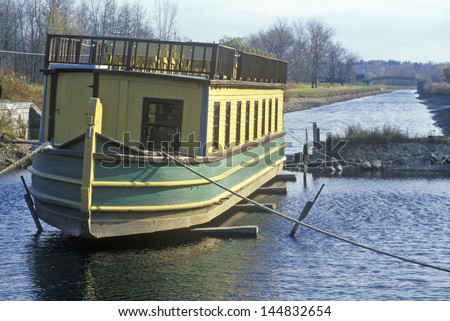 Erie Canal village with barge in Rome, NY