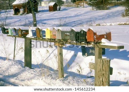 Row of residential mailboxes at winter in rural Woodstock, NY