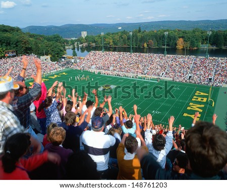 MICHIE STADIUM, NEW YORK - CIRCA 1986: Crowd doing the wave at a college football game in Michie Stadium, New York