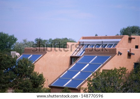 NEW MEXICO - CIRCA 1980\'s: Adobe home with solar panels in New Mexico, USA