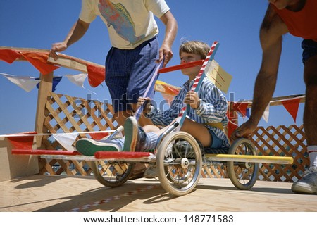 VENICE, LOS ANGELES, CA - CIRCA 1980\'s: Boy in go-cart at starting gate in Venice, Los Angeles, CA
