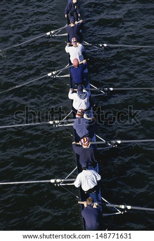 CHARLES RIVER, BOSTON, MA  - CIRCA 1990's: Crew team rowing on water on Charles River in Boston, MA