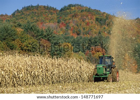 NEW ENGLAND - CIRCA 1980\'s: Tractor harvesting crops in New England, USA