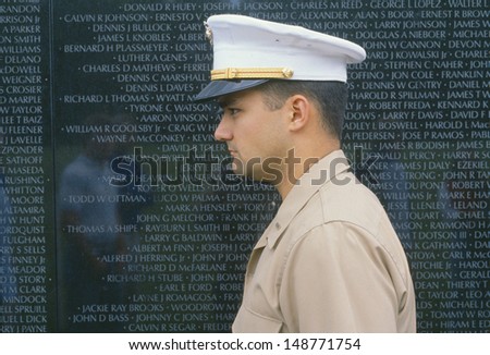 WASHINGTON D.C.  - CIRCA 1986: Military officer in front of Vietnam Veterans Memorial in Washington, DC