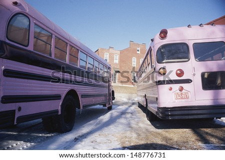 ST. LOUIS, MO. - CIRCA 1990\'s: Pink school buses parking in St Louis, Missouri
